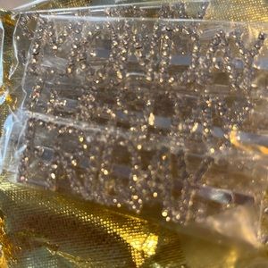 Rhinestone hair clips with days of the week.